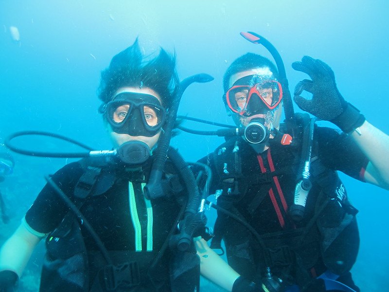 Happy Scuba Divers on European dive trip giving OK sign
